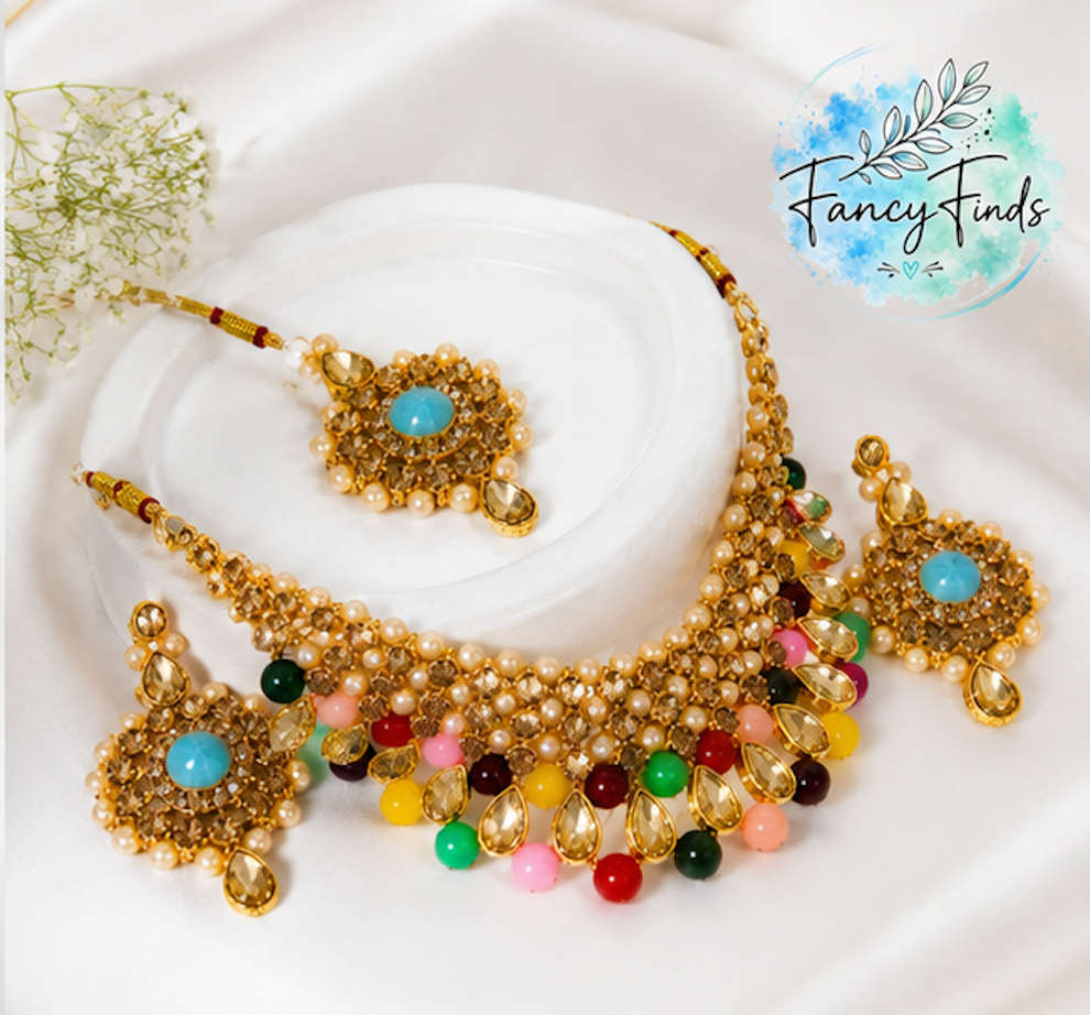 Colorful beaded necklace with matching earrings on a white background, branded 'Fancy Finds'.